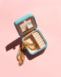 High angle view of beauty products over pink background