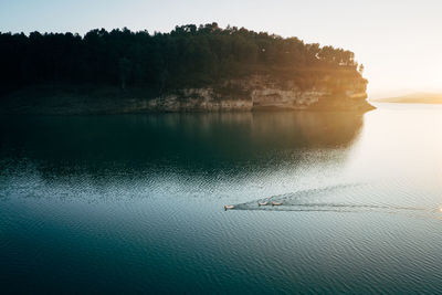 High angle view of lake against sky at sunset