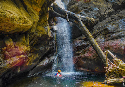 Scenic view of river flowing through cave