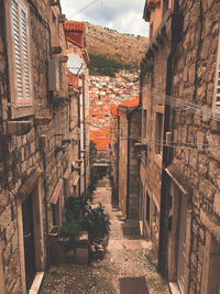 Narrow alley along buildings