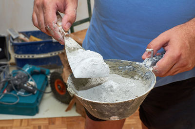 Close-up of man preparing food