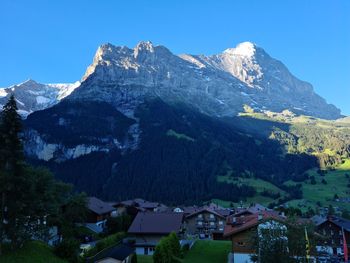 Scenic view of snowcapped mountains against clear sky