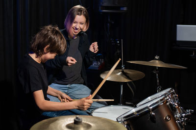 Portrait of boy playing drum