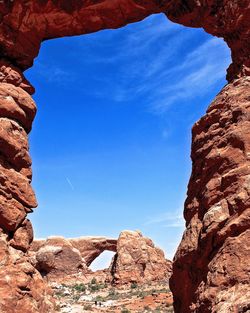 Low angle view of rock formations against sky