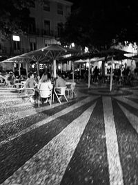 People on street in city at night