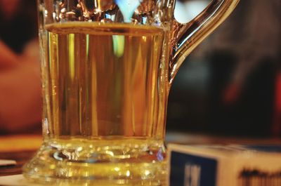 Close-up of beer glass on bar counter