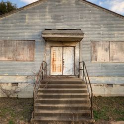 Staircase by old building against sky