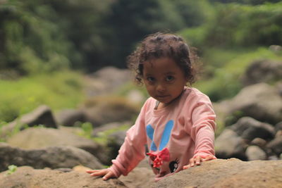 Portrait of girl on rock