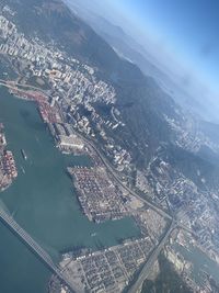 High angle view of buildings and sea in city