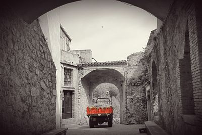 View of old alley amidst buildings