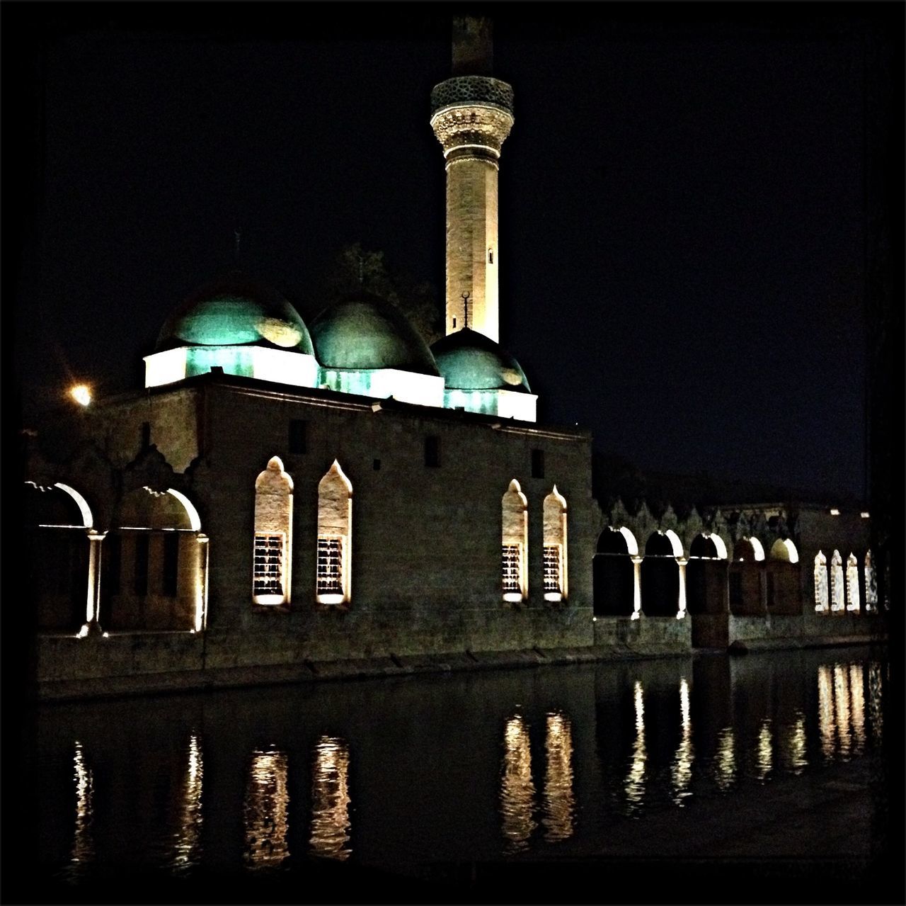 architecture, built structure, building exterior, arch, water, reflection, night, illuminated, clear sky, history, place of worship, waterfront, dome, architectural column, religion, river, facade, outdoors, building, travel destinations