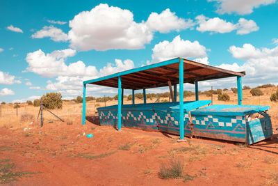 Lifeguard hut on beach against sky