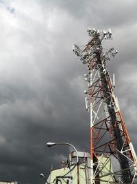 Low angle view of communications tower against sky