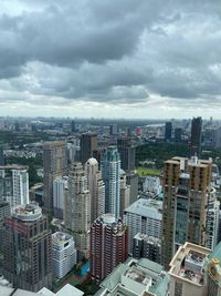 High angle view of modern buildings in city against sky