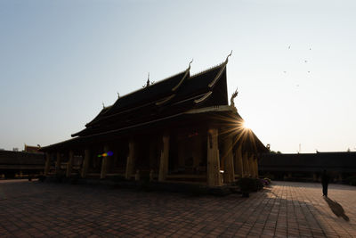 View of temple building against sky during sunset