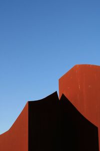 Low angle view of building against clear blue sky