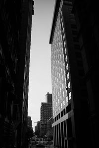 Low angle view of skyscrapers against clear sky