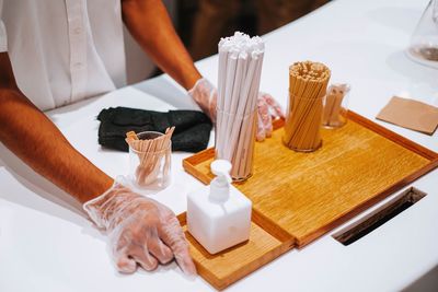 Midsection of man preparing food on table