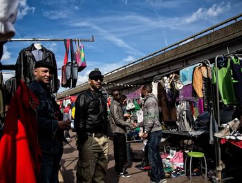 People at market against sky