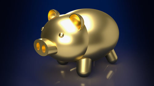 Close-up of yellow toy over blue background