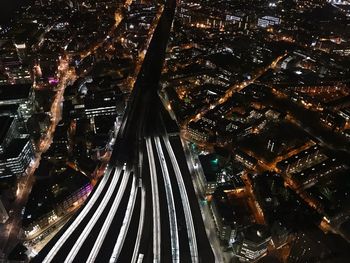 Aerial view of illuminated city at night