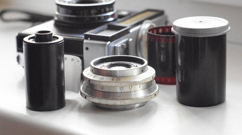 Close-up of photographic equipment on table