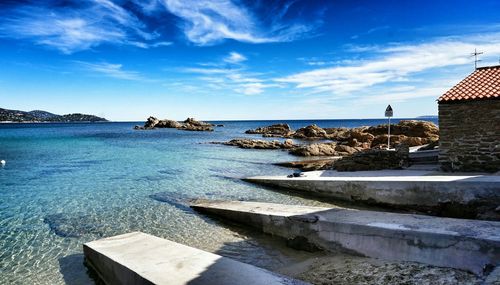 Scenic view of sea against blue sky