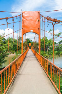 Footbridge against sky