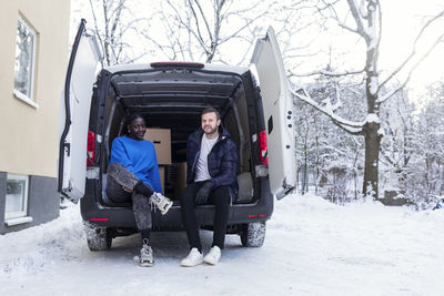 Couple sitting in open van