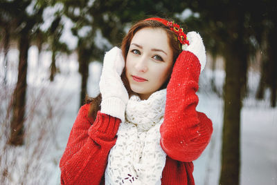 Portrait of young woman with red hair during winter