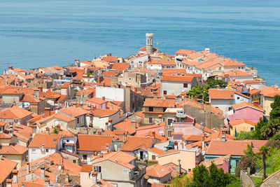 High angle view of townscape by sea