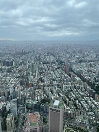 Aerial view of townscape against sky