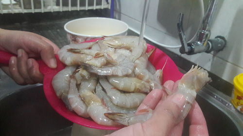 Close-up of man preparing food in kitchen