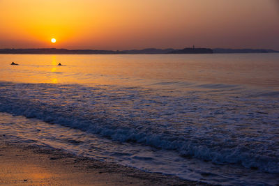 Scenic view of sea against sky during sunset