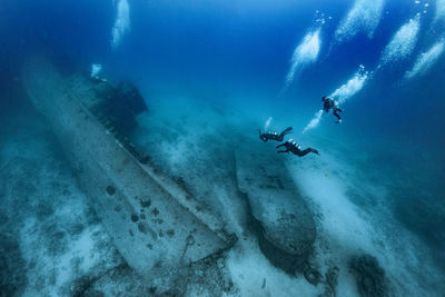 People swimming in sea