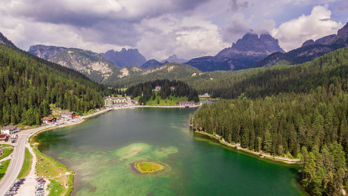 Scenic view of lake and mountains against sky