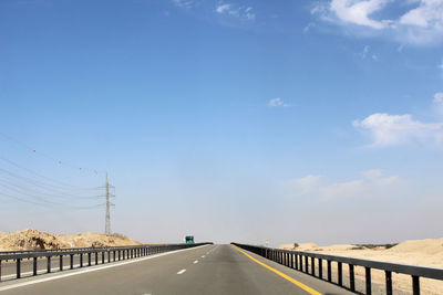 Empty road against sky