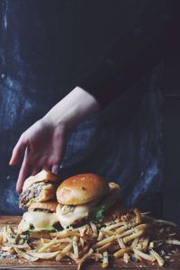 Midsection of woman holding mushrooms