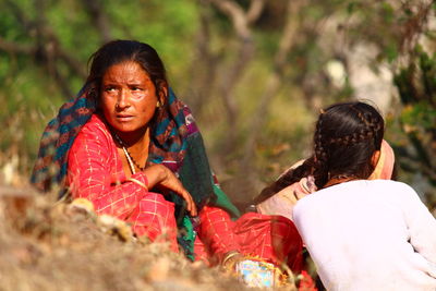 Portrait of women sitting outdoors