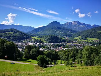 Scenic view of trees and mountains against sky