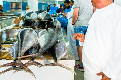 People at fish for sale