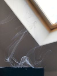 Close-up of curtain against window at home