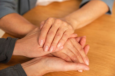 Low section of man massaging woman