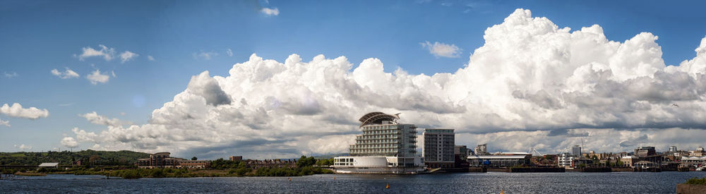 Panoramic view of buildings by harbor