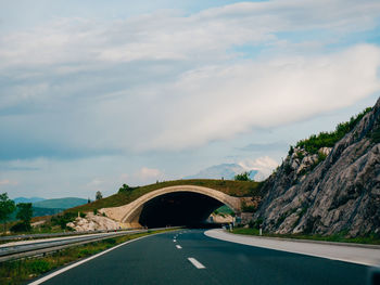 Bridge over road against sky