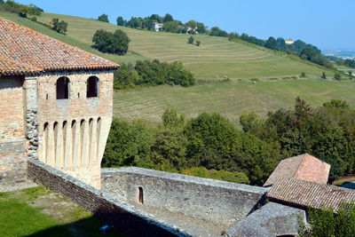 High angle view of trees and buildings against sky