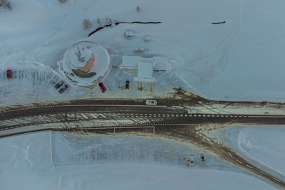 Digital composite image of people on snow covered landscape