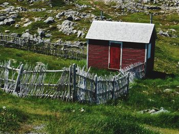 Grass on field against mountain