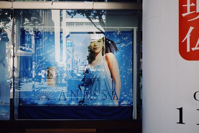 Woman seen through glass window
