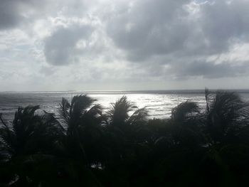 Scenic view of sea against cloudy sky